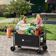 People with gardening tools and plants with a black Hombetta Gardening wagon cart in a garden setting.